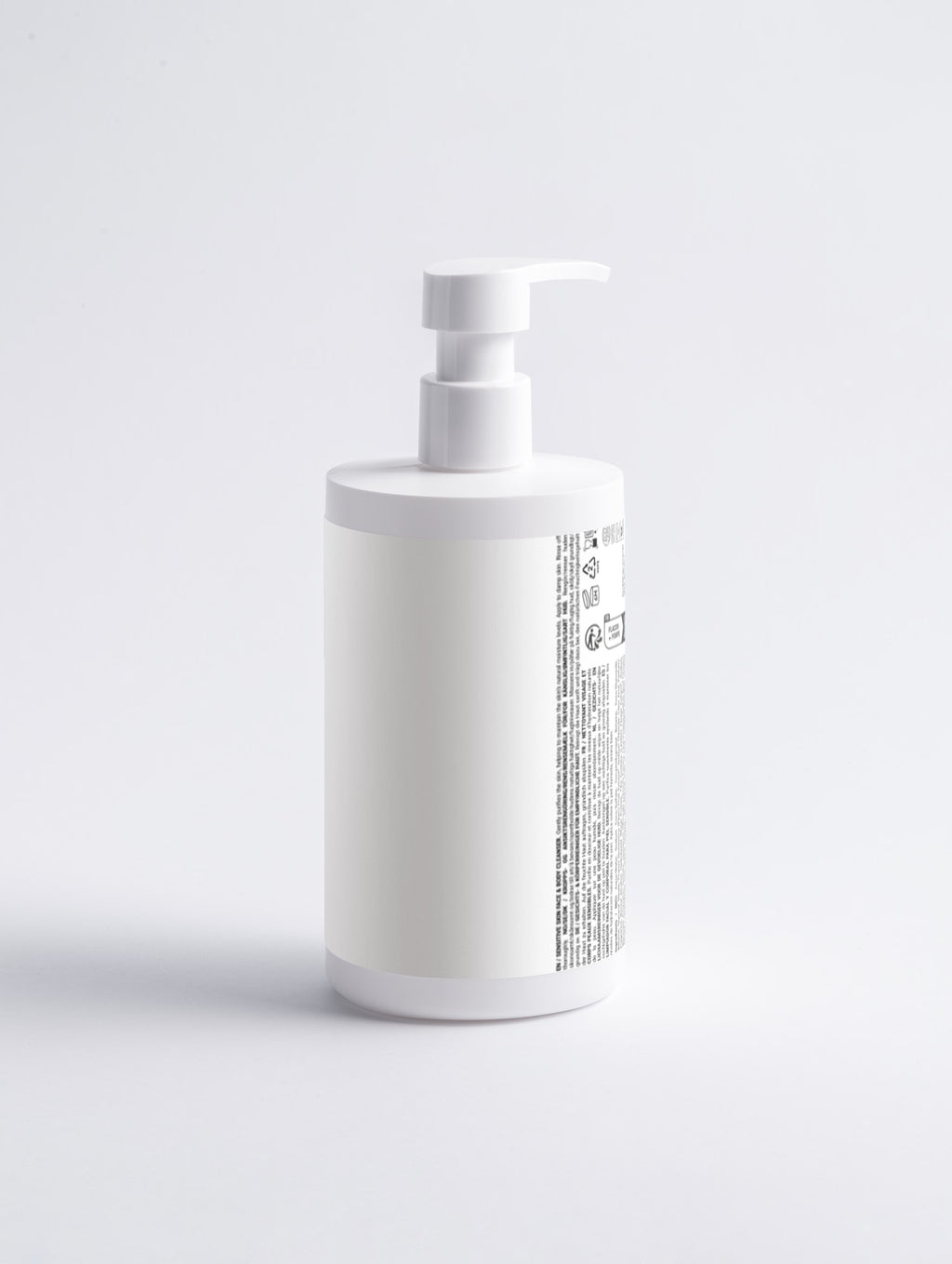 Achterzijde van de witte pompfles gezichts- en lichaamsreiniger van Asmanis ProGel, met productetiket.
